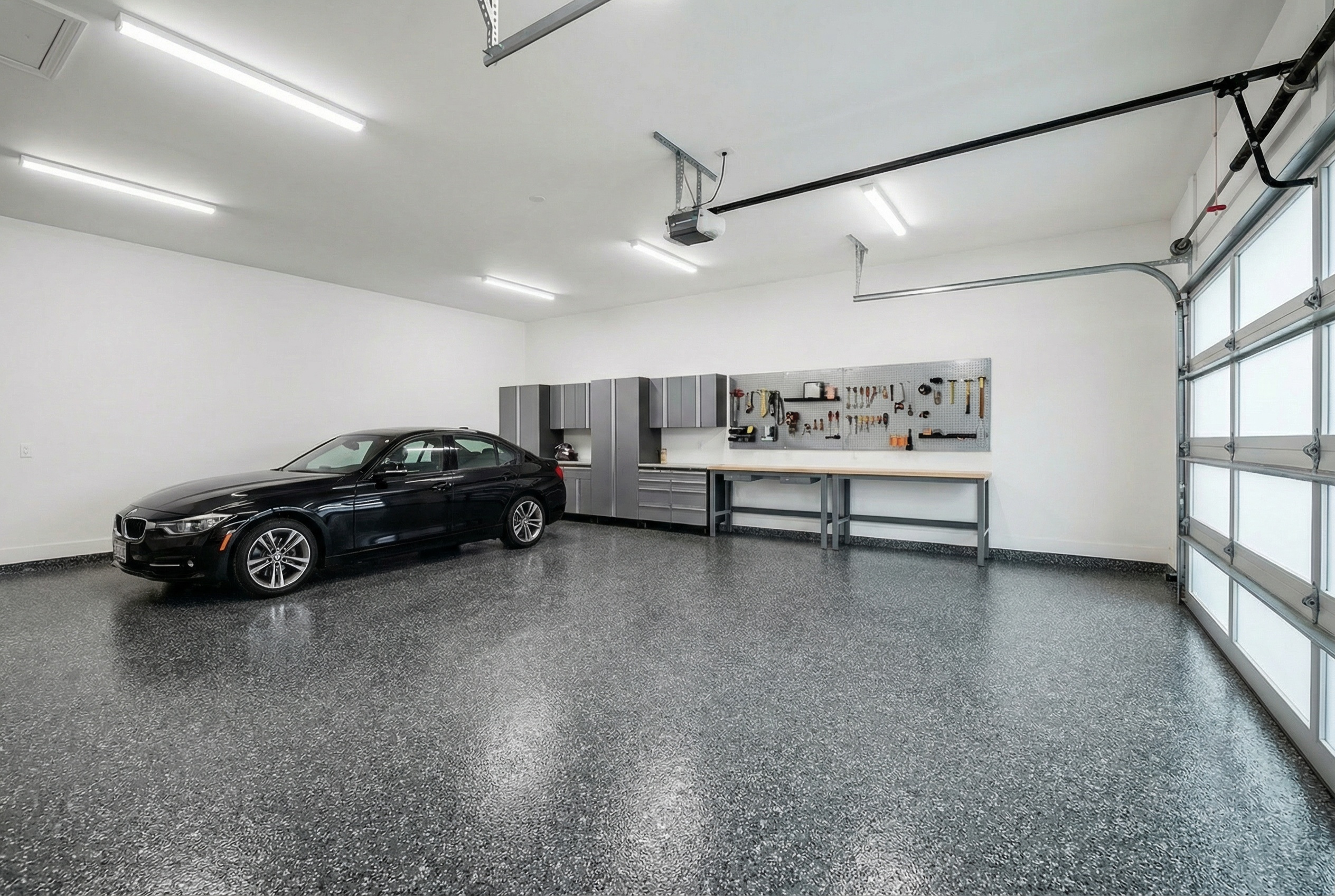 Garage floor visualization with a black and white Penntek Domino flake finish
