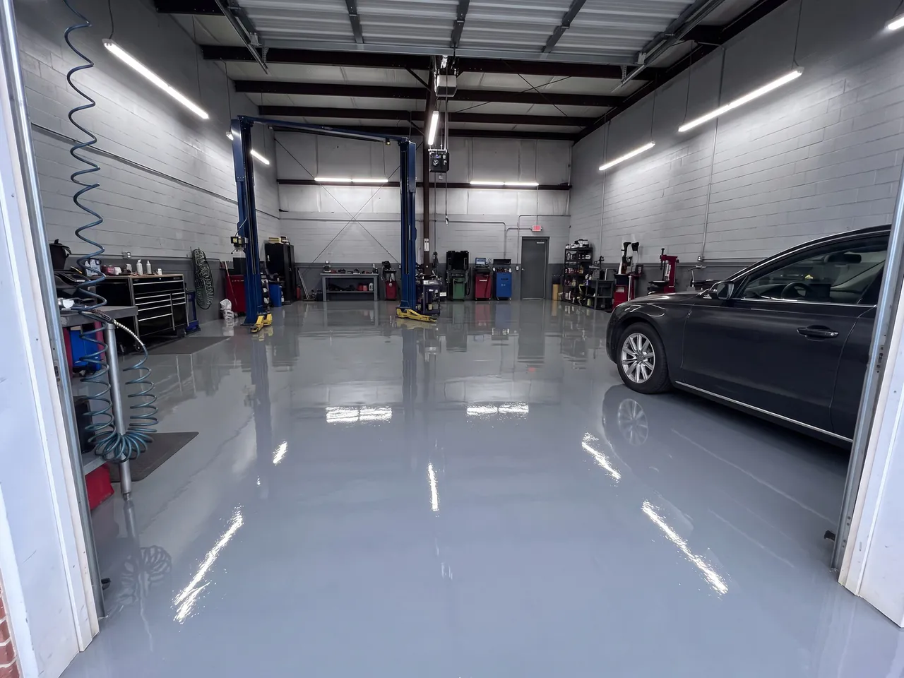Light gray coating preview in an automotive service bay